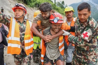 Nepal survivor chant Hare Krishna